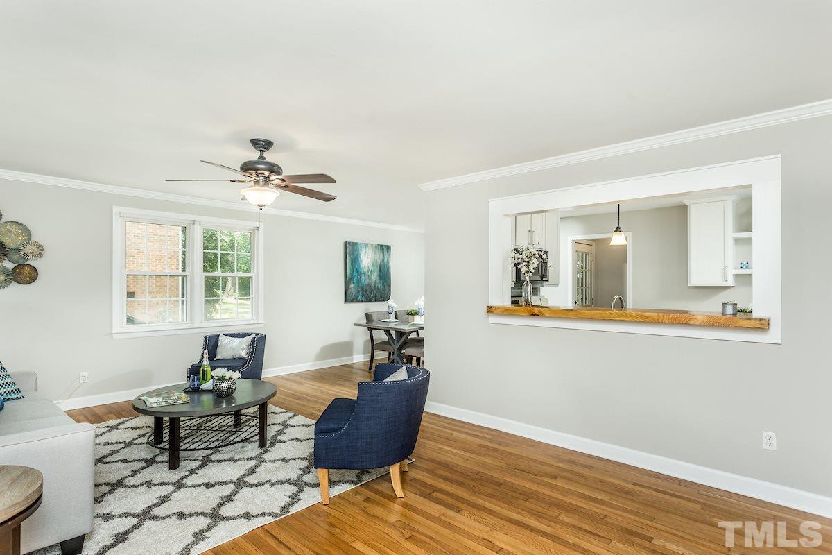 527 Banks Street Raleigh, NC 27604 - Photo 4 of 26 Liviing room with large opening with beautiful wooden top.