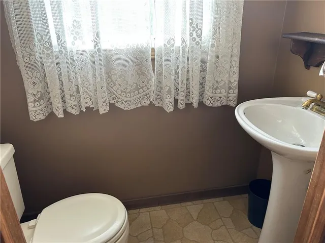 a bathroom with a toilet and a sink