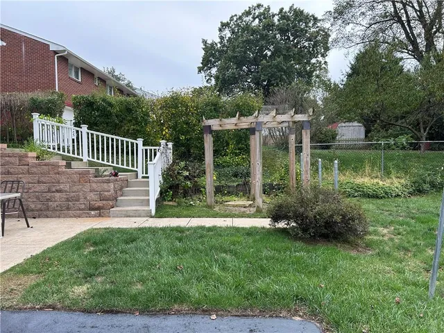 a backyard of a house with trampoline