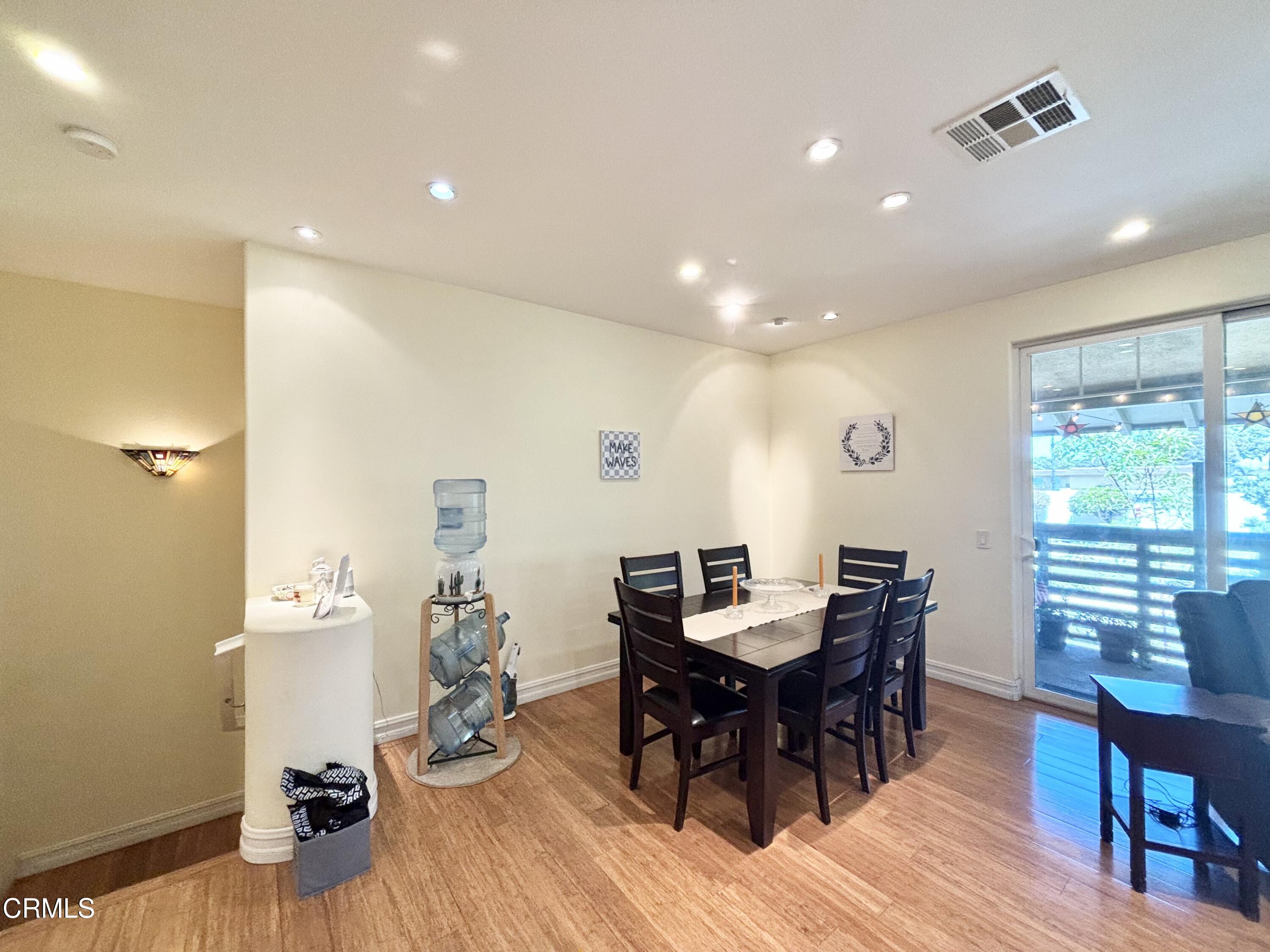 1430 Windshore Way Oxnard, CA 93035 - Photo 11 of 21 a view of a dining room with furniture and wooden floor