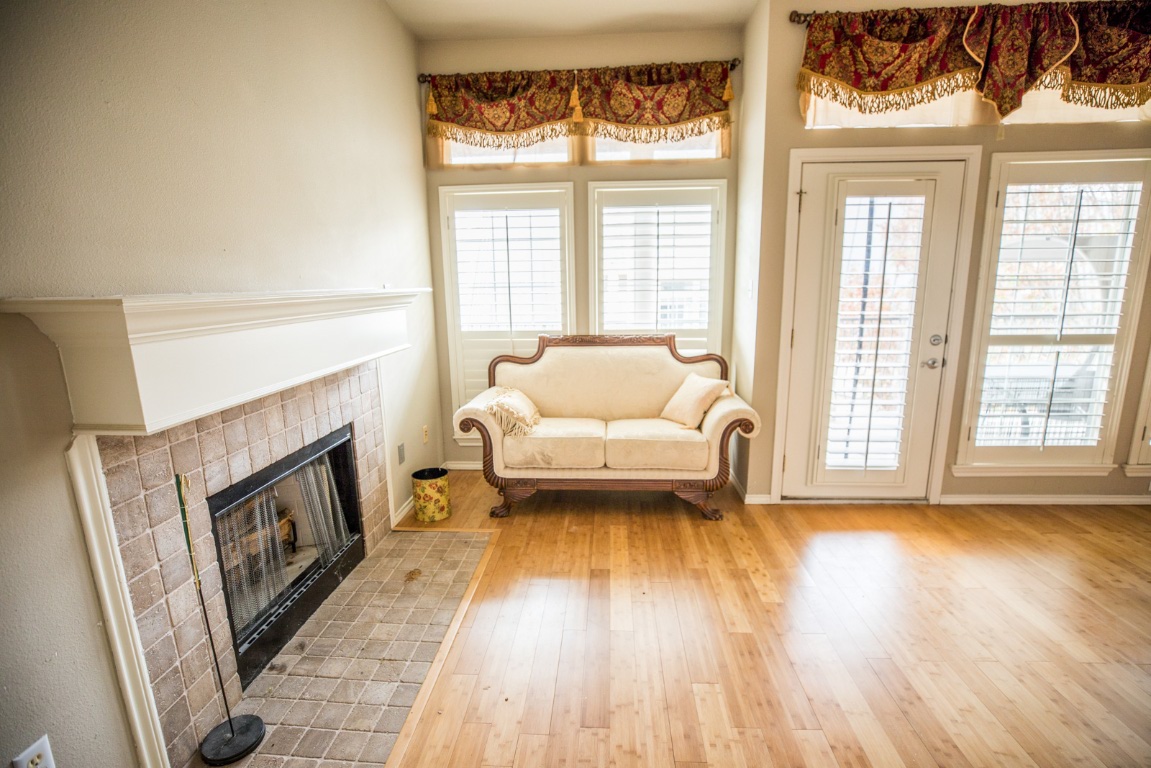 2918 Ranch Road 620 North, Unit 270 Austin, TX 78734 - Photo 16 of 34 a living room with furniture and a fireplace