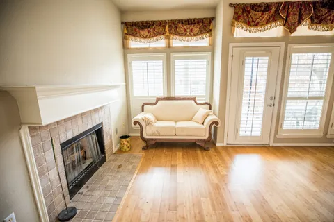 a living room with furniture and a fireplace