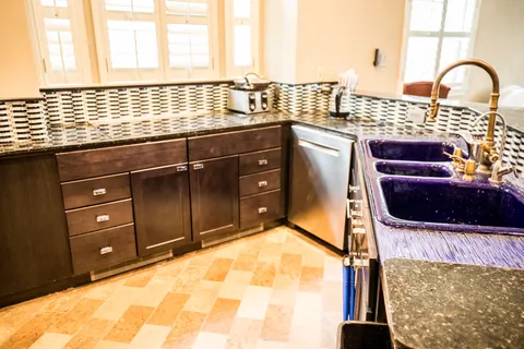 a kitchen with a sink and a large window