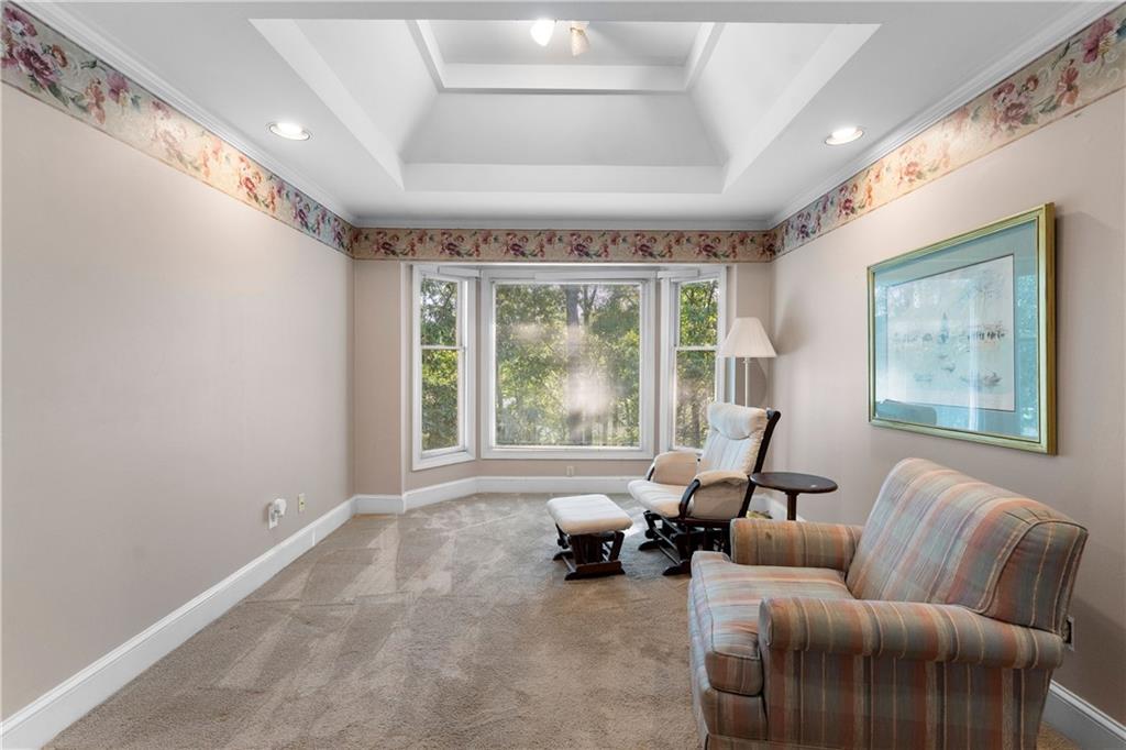 24 Commerce Row Northeast Cartersville, GA 30121 - Photo 18 of 37 a living room with furniture and large windows
