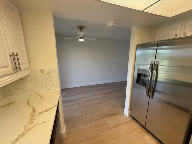 a view of a refrigerator in kitchen