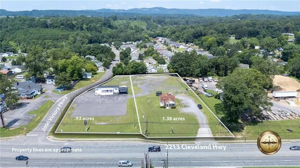 an aerial view of swimming pool with a garden