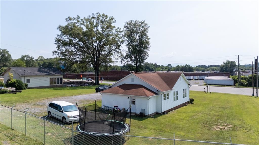 2213 Cleveland Highway Dalton, GA 30721 - Photo 11 of 41 a front view of a house with swimming pool garden and patio