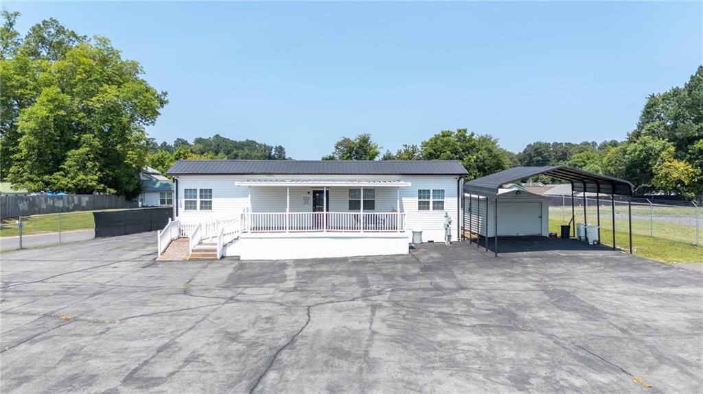 2213 Cleveland Highway Dalton, GA 30721 - Photo 13 of 41 a view of house with outdoor space and swimming pool