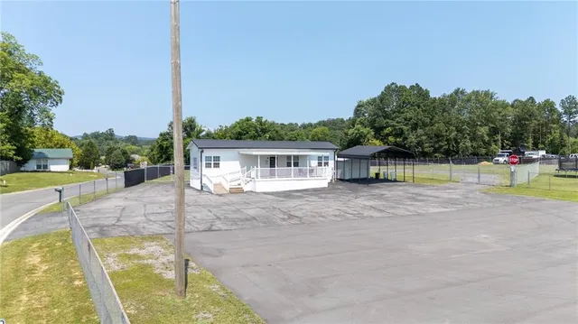 a view of a swimming pool with a chair and tables