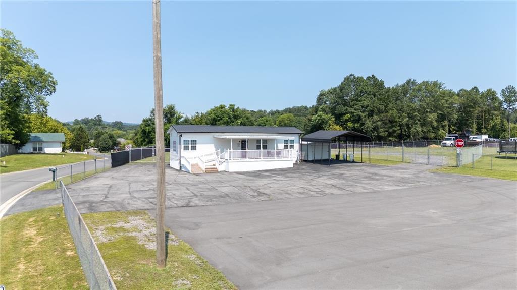 2213 Cleveland Highway Dalton, GA 30721 - Photo 15 of 41 a view of a house with a swimming pool