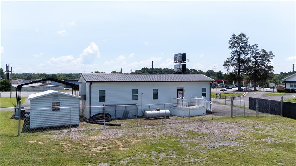 2213 Cleveland Highway Dalton, GA 30721 - Photo 18 of 41 a view of a house with backyard and furniture