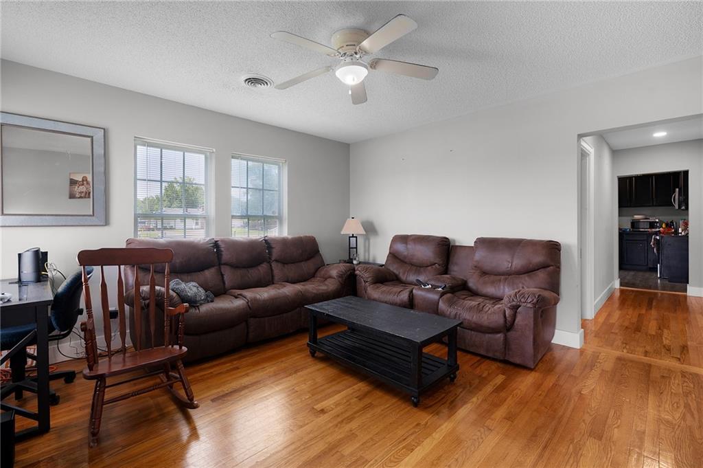 2213 Cleveland Highway Dalton, GA 30721 - Photo 24 of 41 a living room with furniture and a wooden floor