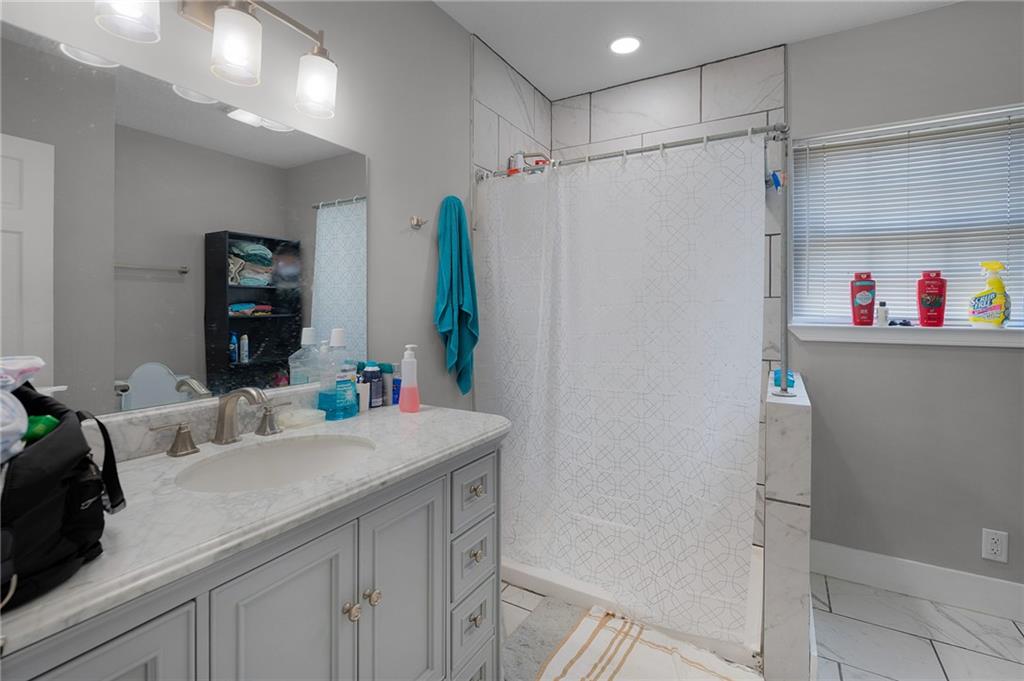 2213 Cleveland Highway Dalton, GA 30721 - Photo 28 of 41 a bathroom with a sink and a mirror