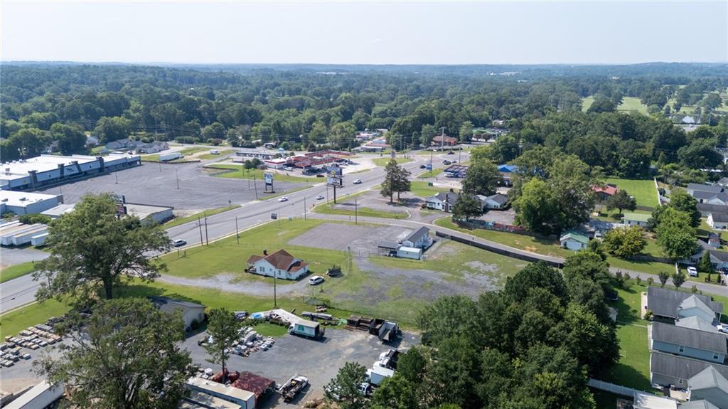 2213 Cleveland Highway Dalton, GA 30721 - Photo 3 of 41 an aerial view of residential houses with outdoor space