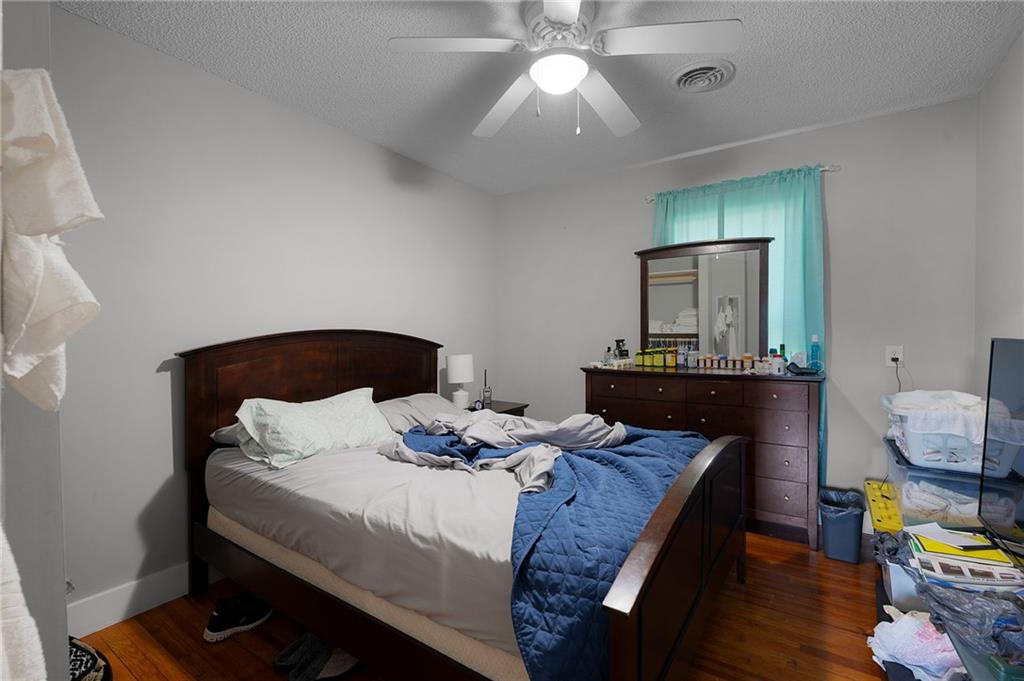 2213 Cleveland Highway Dalton, GA 30721 - Photo 32 of 41 a bedroom with bed and a mirror