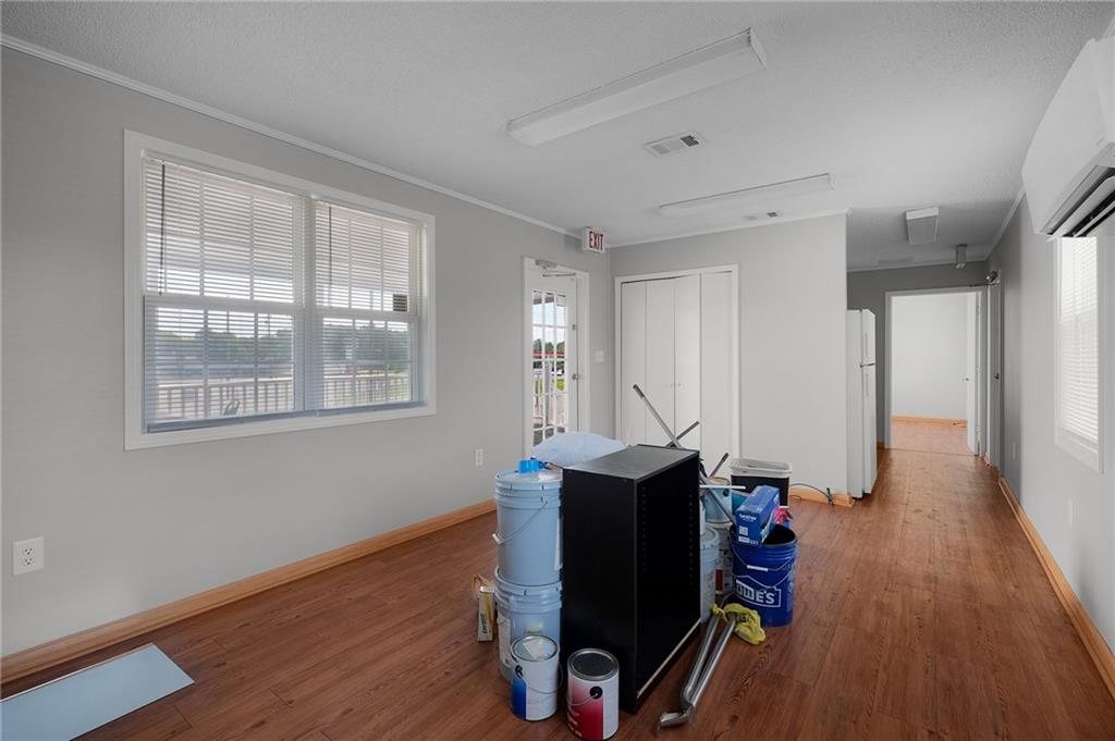 2213 Cleveland Highway Dalton, GA 30721 - Photo 35 of 41 a view of a workspace with furniture and a window