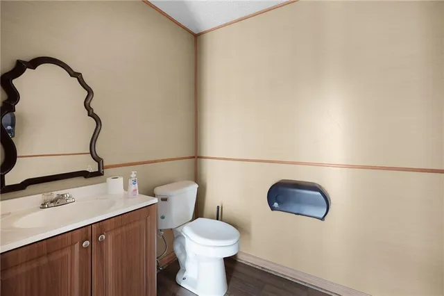 a view of a wooden deck with lake view