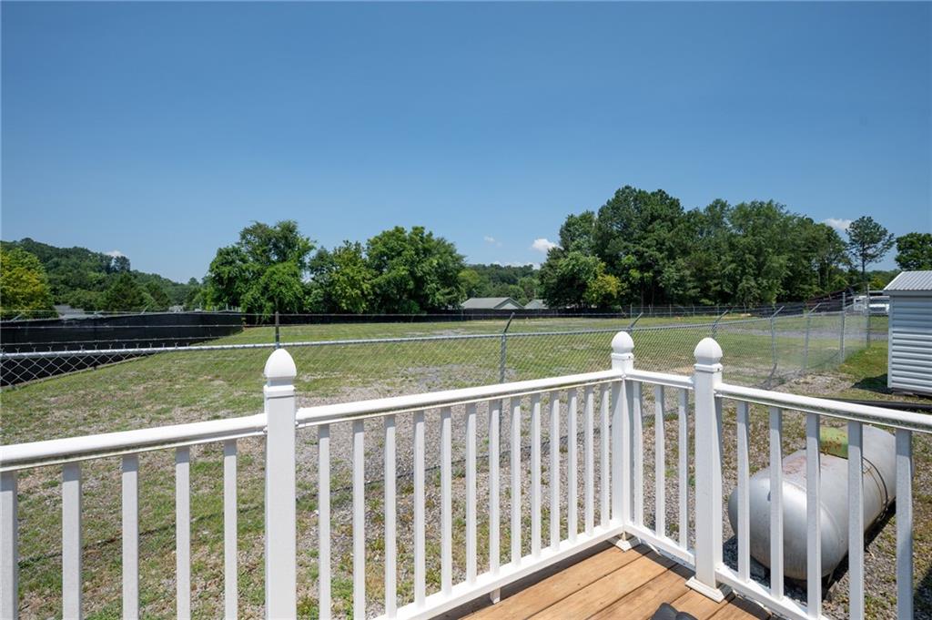 2213 Cleveland Highway Dalton, GA 30721 - Photo 39 of 41 a view of a wooden deck with lake view