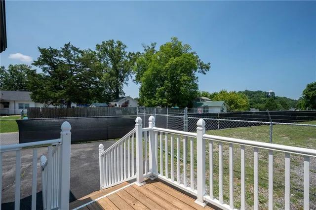 a view of a door and wooden floor