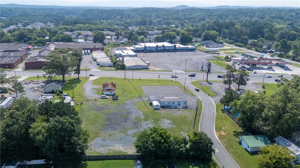 2213 Cleveland Highway Dalton, GA 30721 - Photo 4 of 41 an aerial view of residential houses with outdoor space and parking