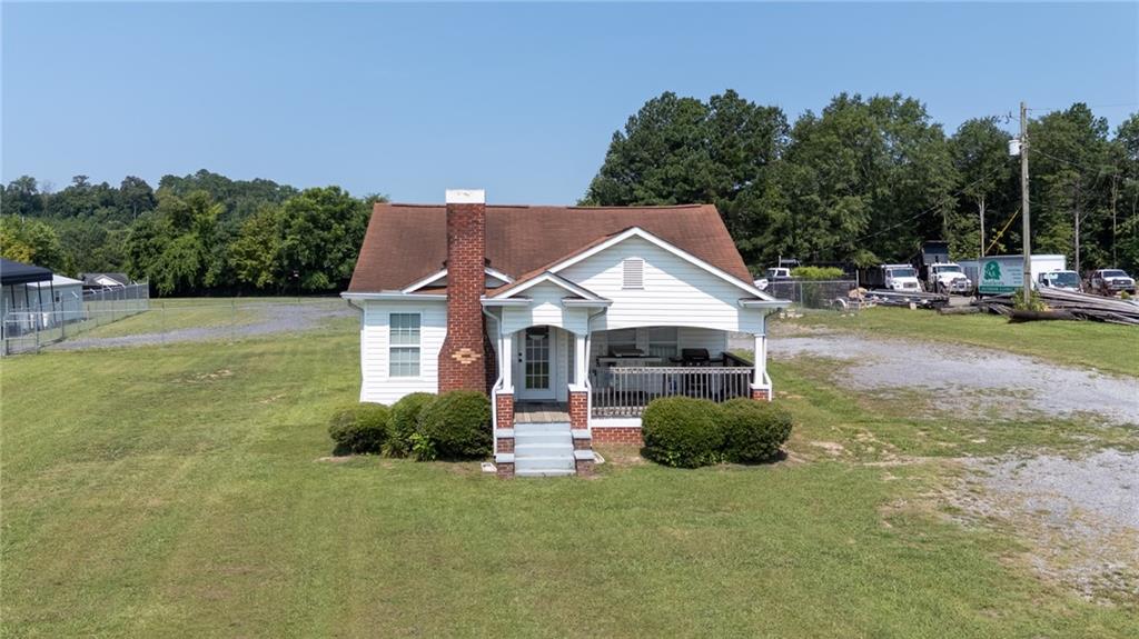 2213 Cleveland Highway Dalton, GA 30721 - Photo 7 of 41 a view of a house with backyard and sitting area
