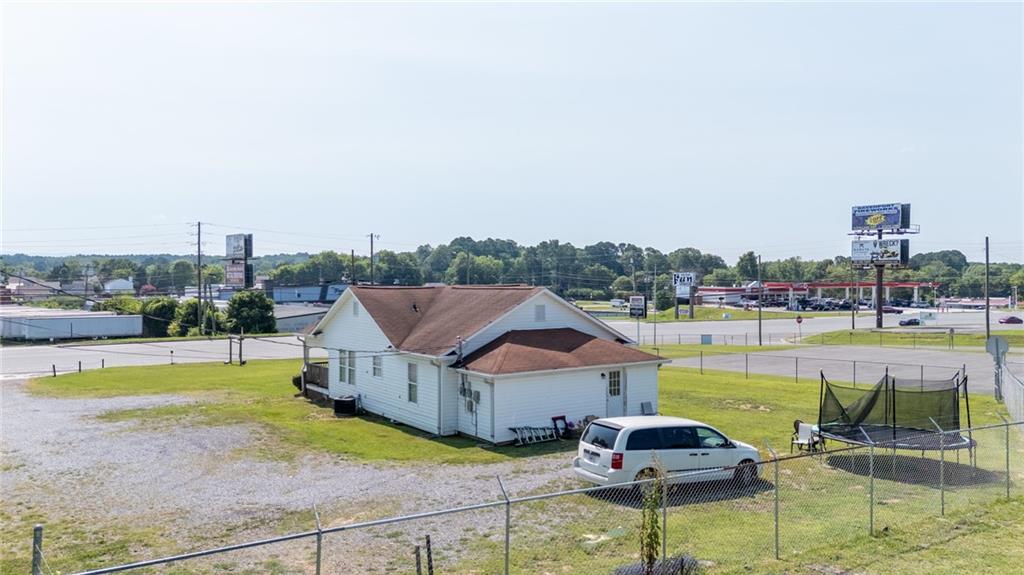 2213 Cleveland Highway Dalton, GA 30721 - Photo 9 of 41 a house with swimming pool in front of it