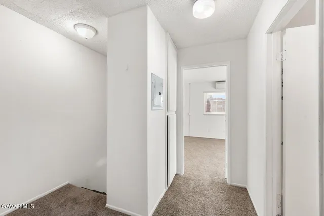 a bathroom with a granite countertop sink mirror vanity and toilet