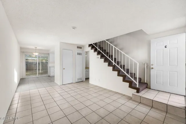 a view of an entryway with stairs