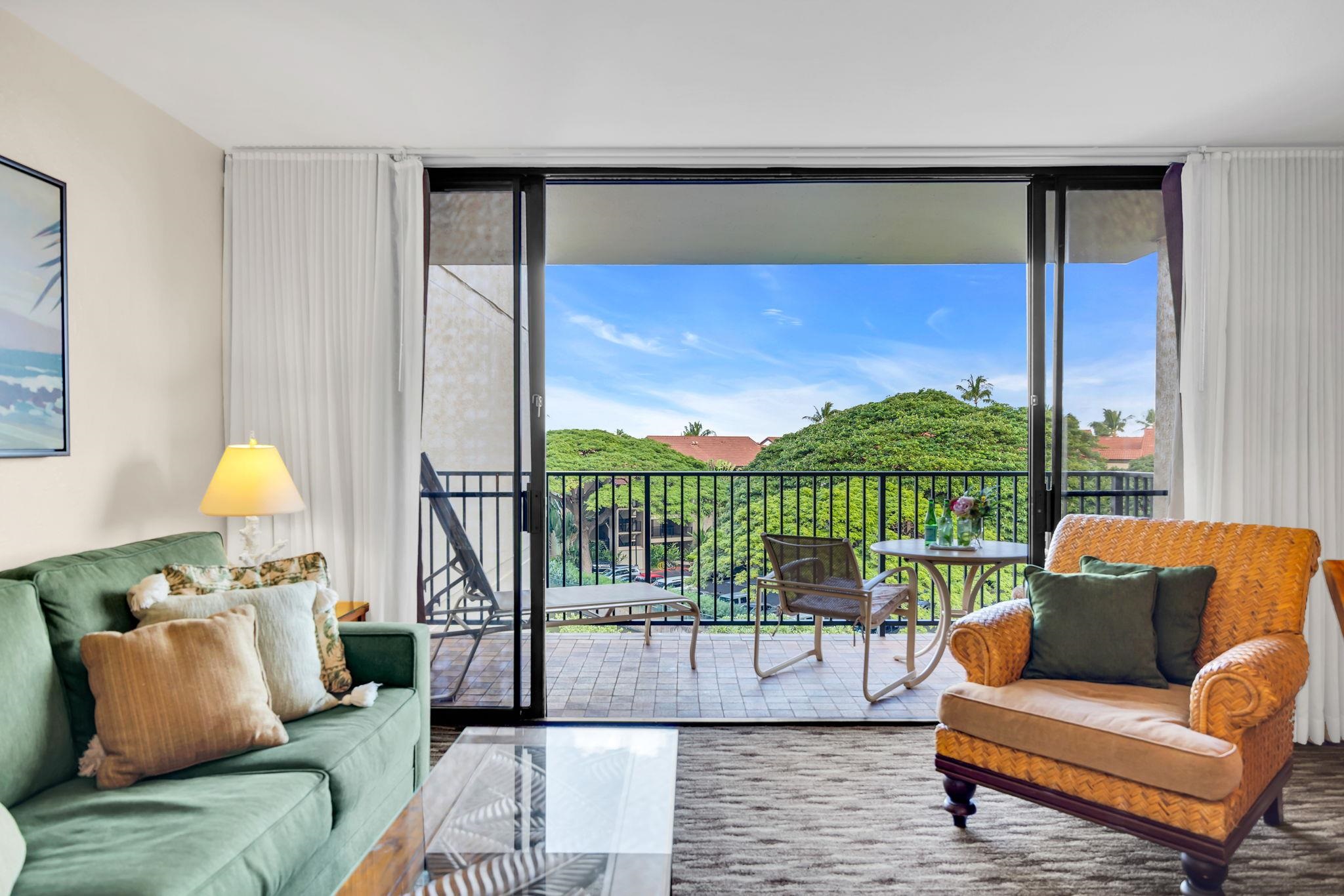 3445 Lower Honoapiilani Road, Unit 516 Lahaina, HI 96761 - Photo 11 of 49 a living room with furniture and a floor to ceiling window