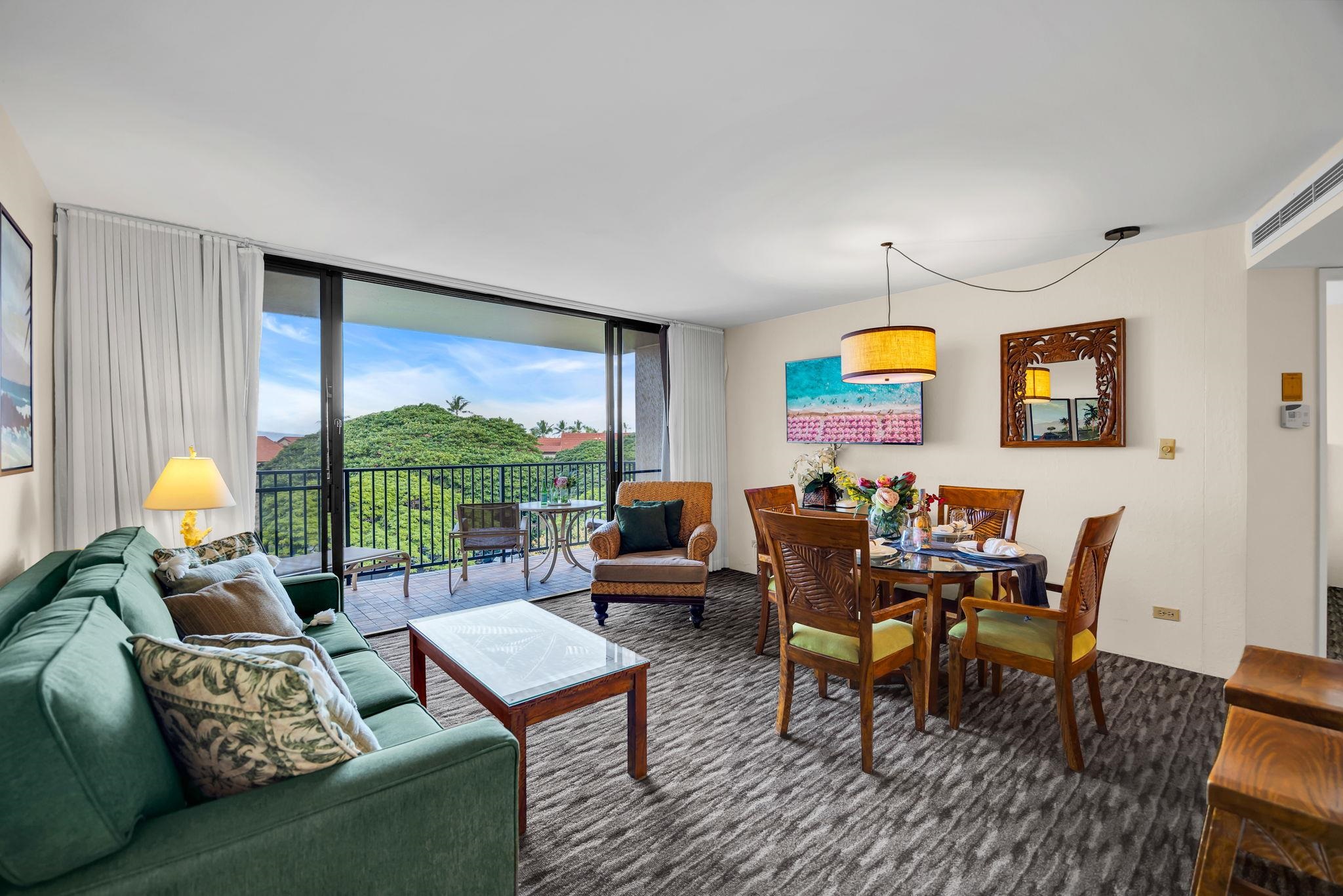 3445 Lower Honoapiilani Road, Unit 516 Lahaina, HI 96761 - Photo 12 of 49 a living room with furniture and a large window