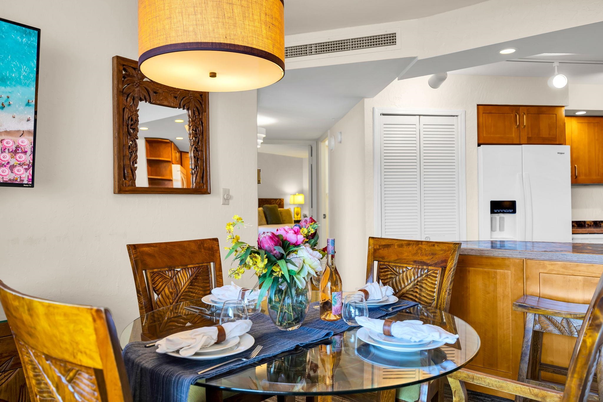 3445 Lower Honoapiilani Road, Unit 516 Lahaina, HI 96761 - Photo 13 of 49 a dining room with furniture and wooden floor