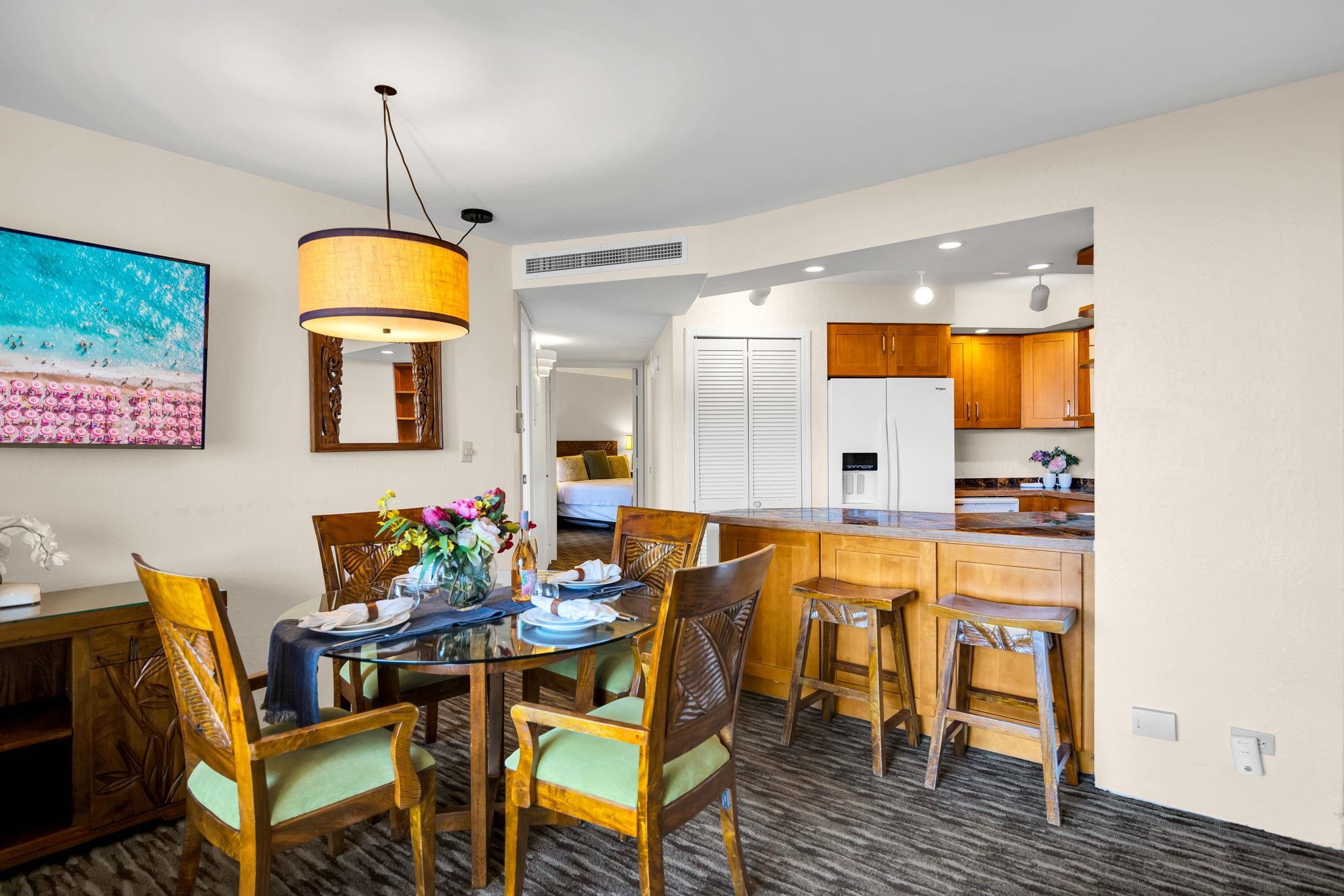 3445 Lower Honoapiilani Road, Unit 516 Lahaina, HI 96761 - Photo 14 of 49 a view of a dining room with furniture and wooden floor