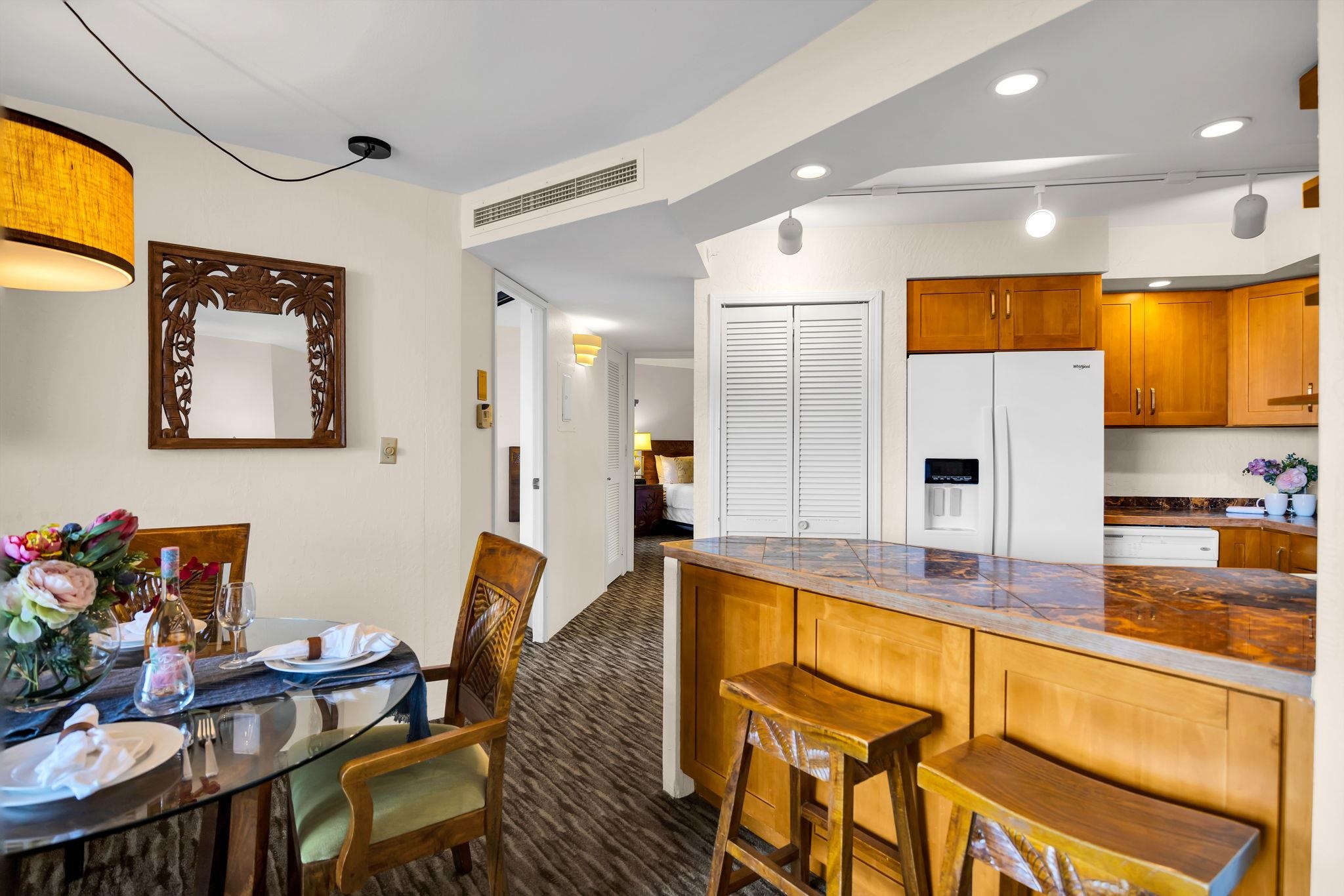3445 Lower Honoapiilani Road, Unit 516 Lahaina, HI 96761 - Photo 17 of 49 a kitchen with stainless steel appliances granite countertop a sink and cabinets