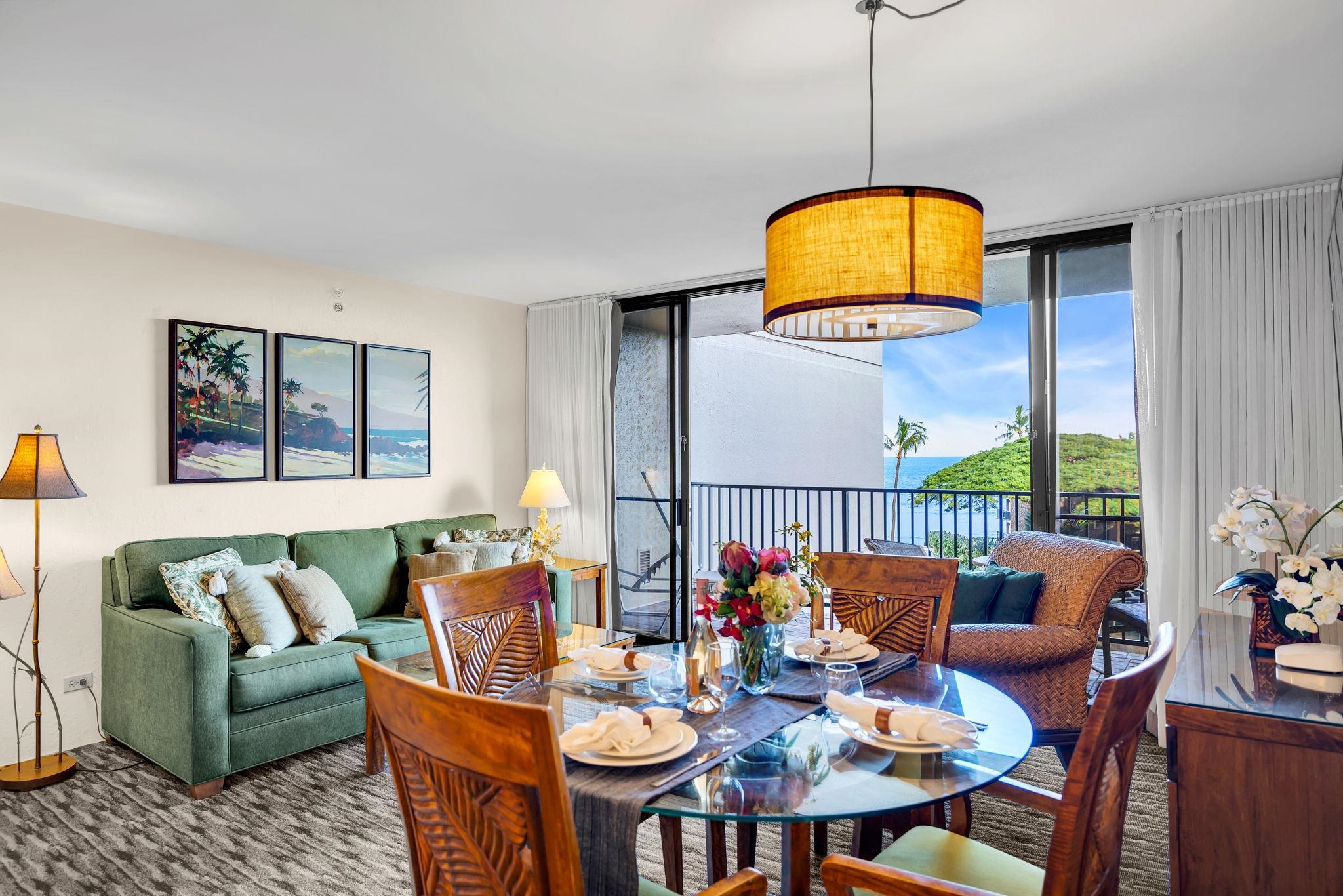 3445 Lower Honoapiilani Road, Unit 516 Lahaina, HI 96761 - Photo 9 of 49 a view of a dining room with furniture and chandelier