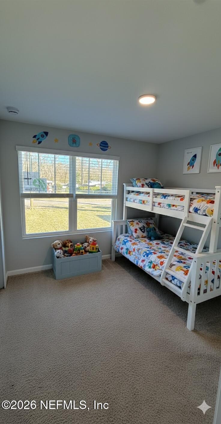 1076 Cahoon Road South Jacksonville, FL 32221 - Photo 6 of 7 a view of a room with wooden floor and furniture