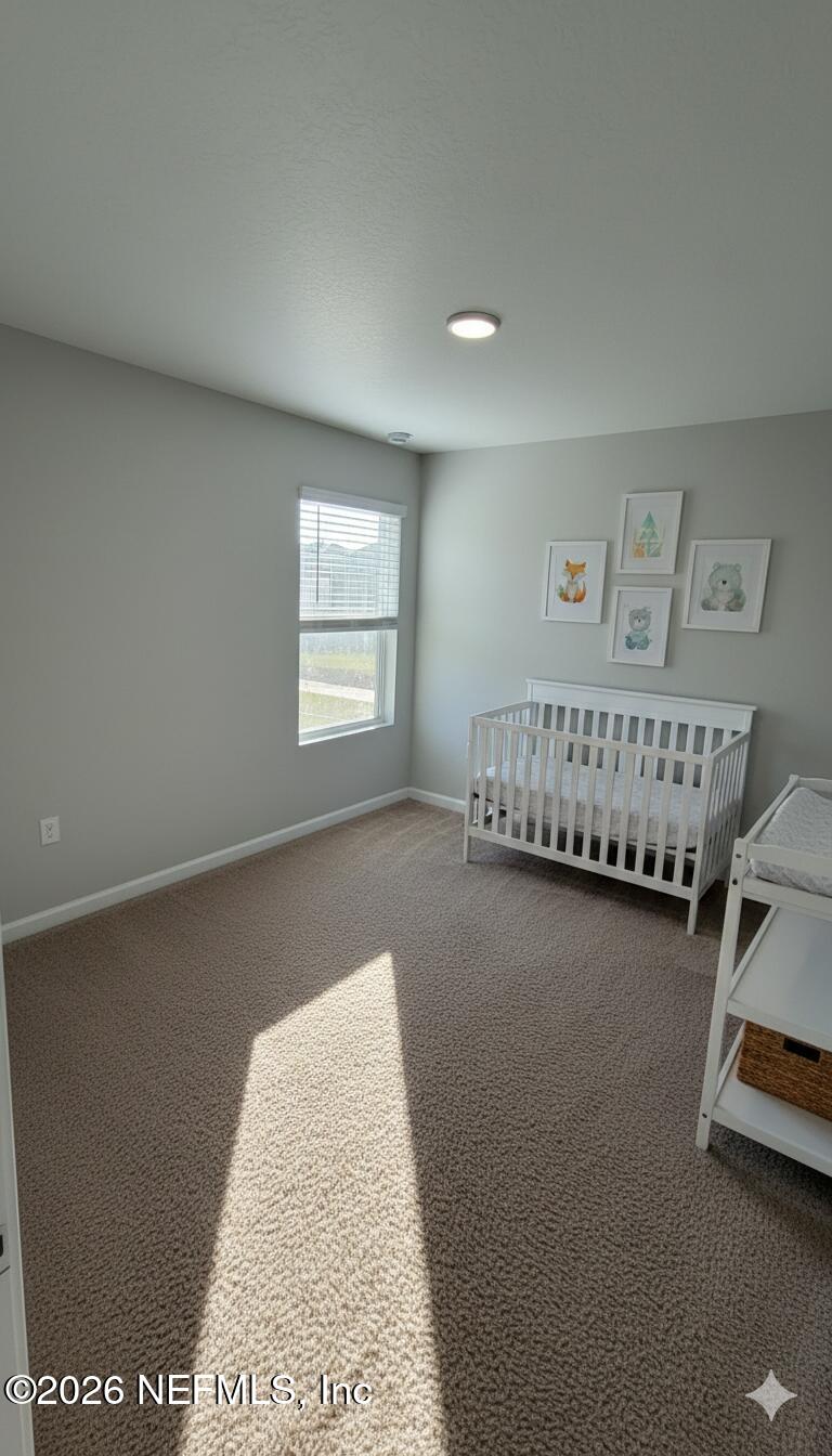 1076 Cahoon Road South Jacksonville, FL 32221 - Photo 7 of 7 a view of a bedroom with furniture and windows
