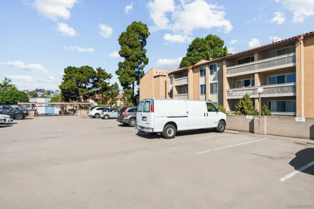 a view of a street with a cars park
