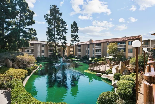 an aerial view of house with yard swimming pool and outdoor seating