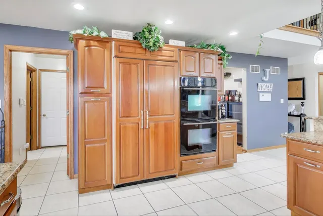 a view of a dining room with furniture chandelier and a chandelier
