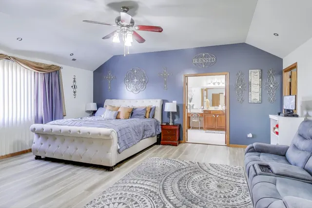a living room with a couch and a chandelier