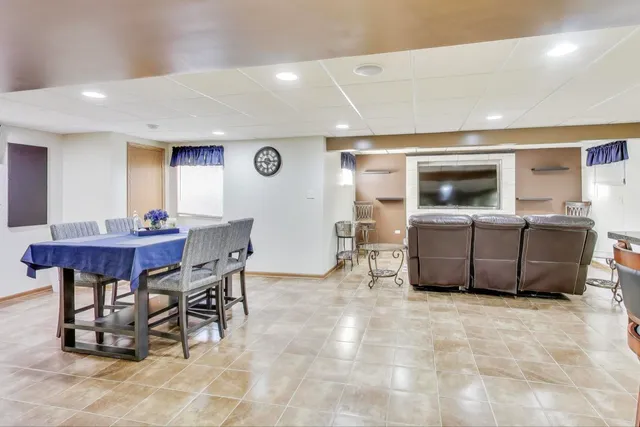 a living room with furniture and gym equipment