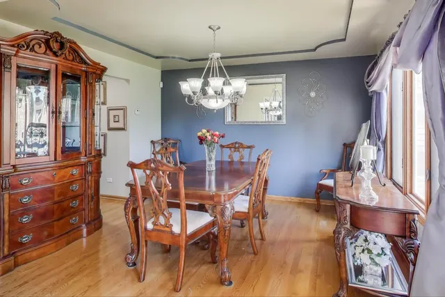 a large kitchen with lots of counter and chairs