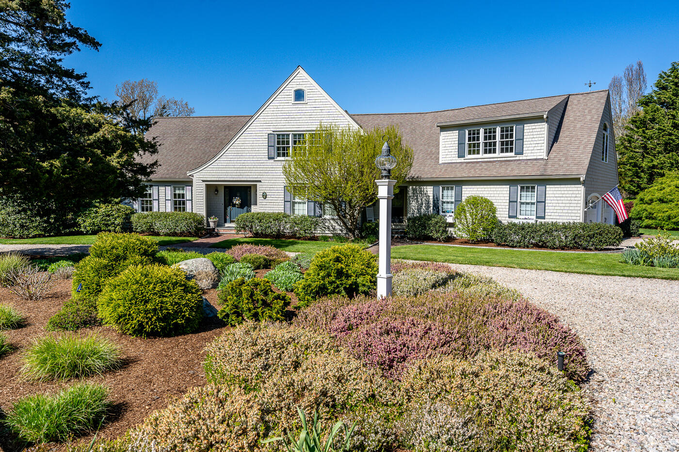 a front view of house with yard and green space