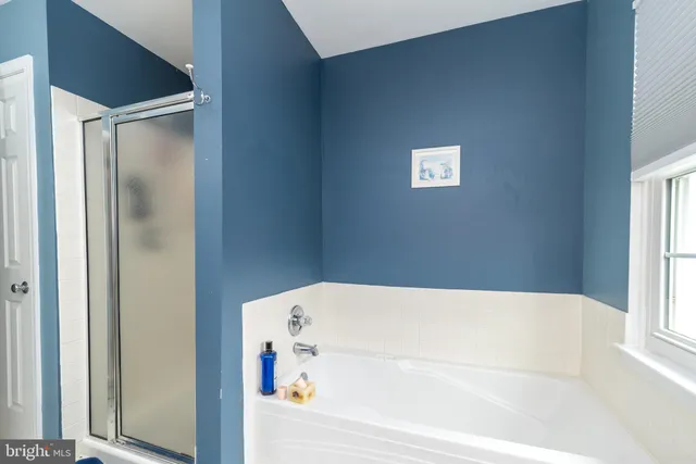 a bathroom with a sink vanity and a mirror