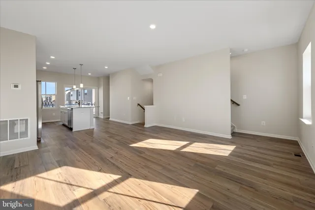 a view of outdoor space with wooden floor and windows