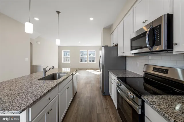 a bathroom with sink and mirror