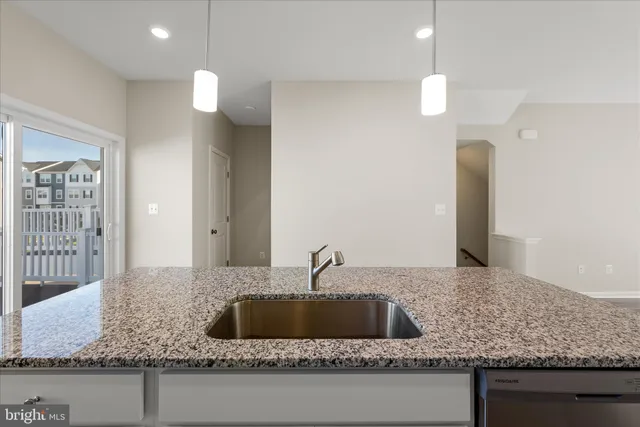 a bathroom with a sink toilet and a mirror