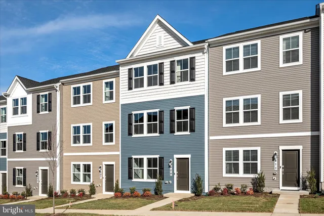 a front view of a building with a yard