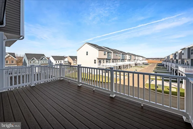 a view of a house with wooden deck