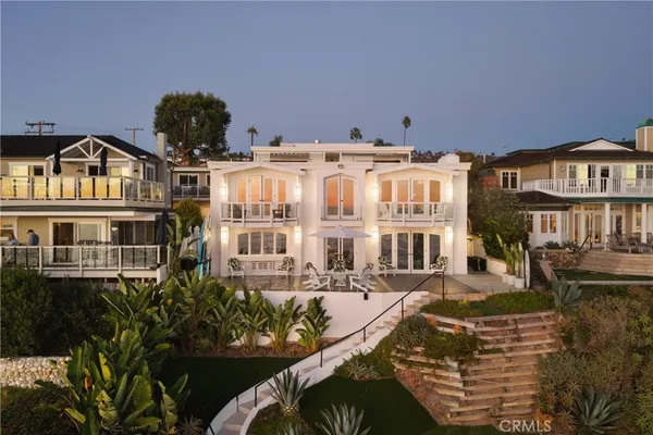a front view of a residential apartment building with a yard